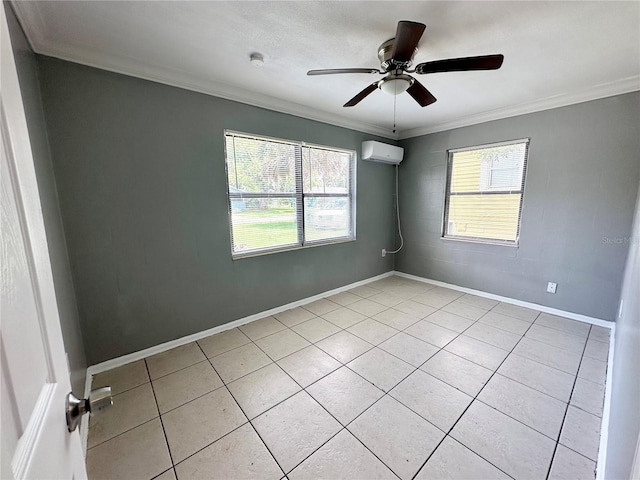 tiled spare room featuring a wall unit AC, ceiling fan, and crown molding