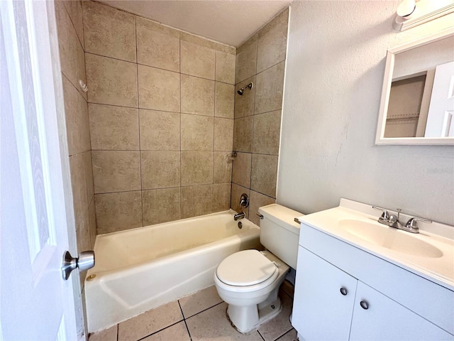 full bathroom featuring vanity, tile patterned floors, tiled shower / bath combo, and toilet