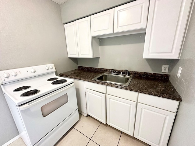 kitchen with white cabinetry, sink, light tile patterned flooring, and white electric range oven