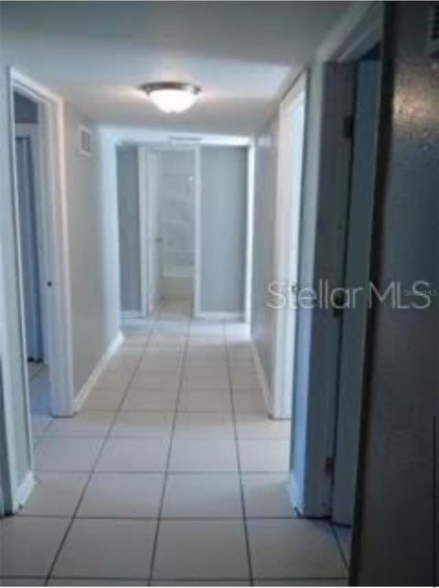 hallway with light tile patterned flooring