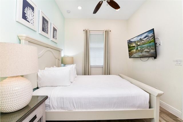 bedroom with hardwood / wood-style flooring and ceiling fan