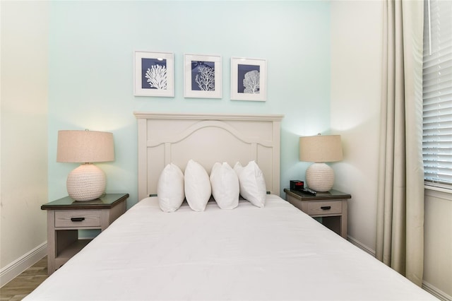 bedroom featuring hardwood / wood-style floors