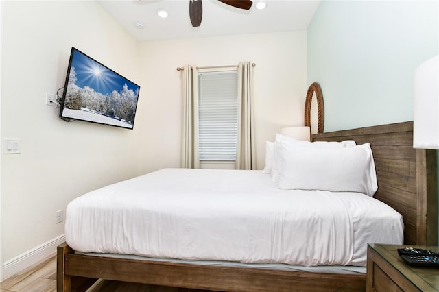 bedroom featuring hardwood / wood-style flooring and ceiling fan