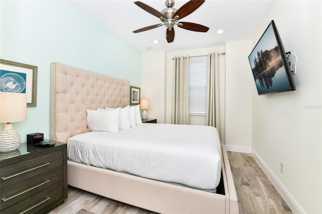 bedroom featuring ceiling fan and light hardwood / wood-style floors