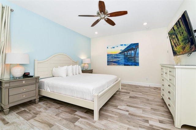 bedroom with ceiling fan and light wood-type flooring