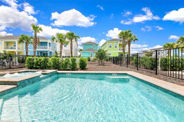 view of pool featuring an in ground hot tub