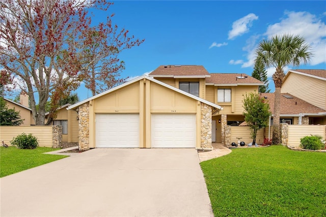 view of front of home featuring a front lawn and a garage