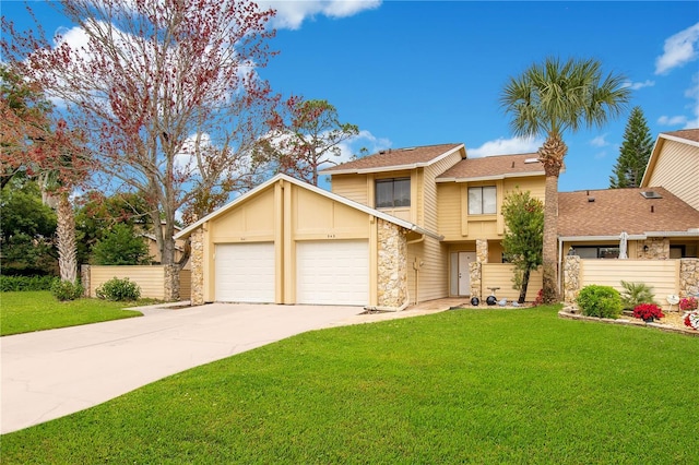 view of front of house with a front lawn and a garage