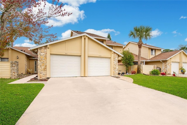 view of front of property featuring a garage and a front yard