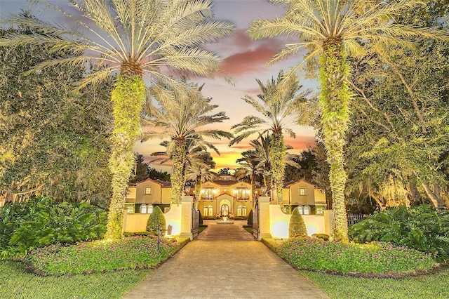 view of outdoor building at dusk