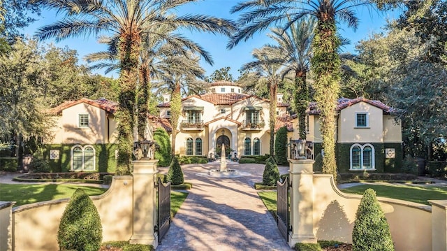 mediterranean / spanish-style house with a balcony