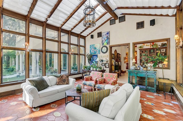 sunroom / solarium with vaulted ceiling with beams and a chandelier