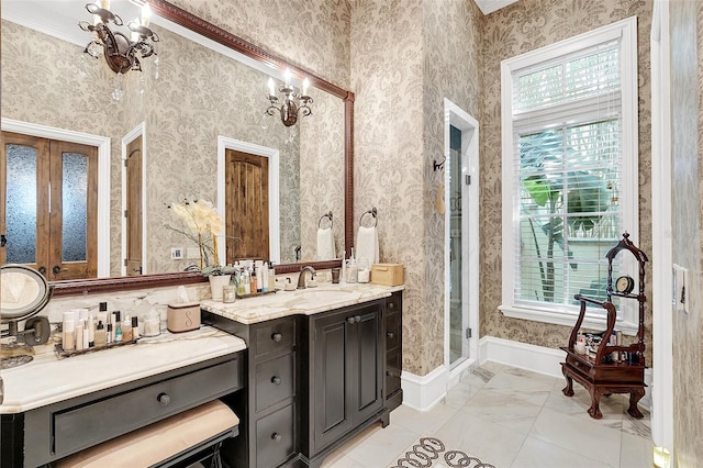 bathroom featuring crown molding, vanity, a chandelier, and walk in shower