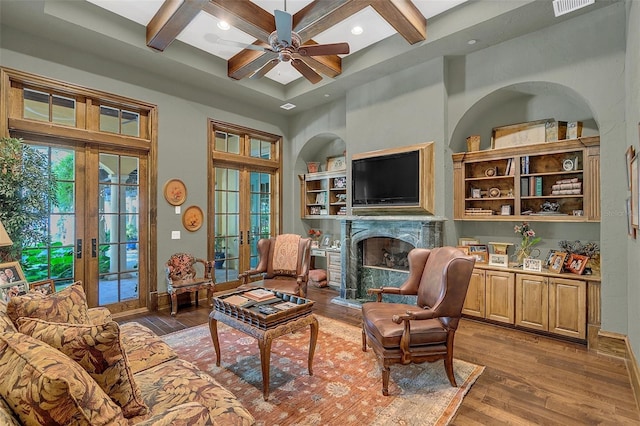 sitting room with french doors, beamed ceiling, dark hardwood / wood-style floors, and coffered ceiling