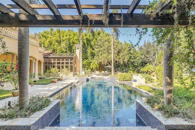 view of swimming pool with a pergola and a patio area