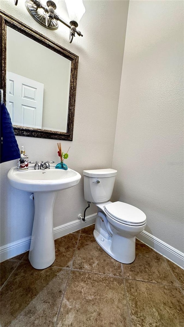 bathroom featuring sink and toilet