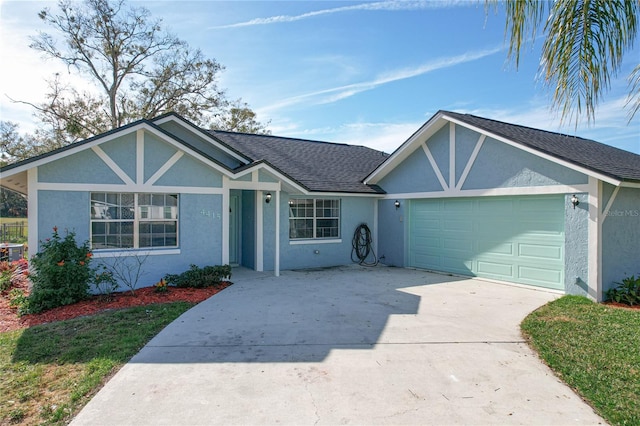 single story home featuring a garage