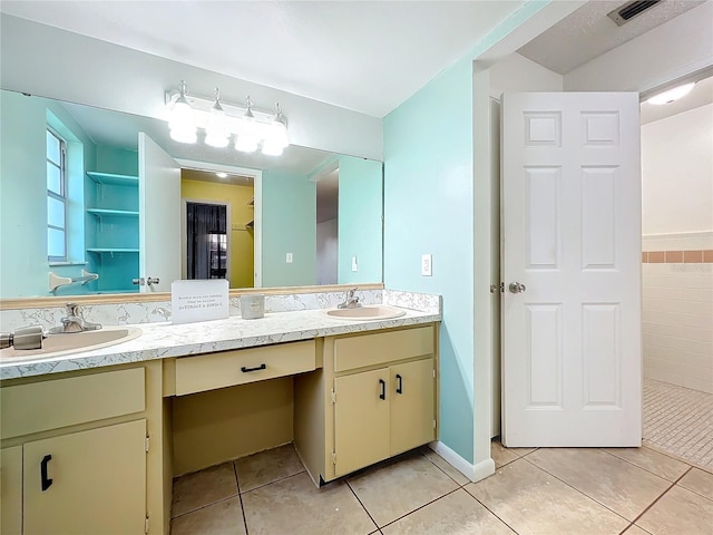 bathroom with vanity and tile patterned floors