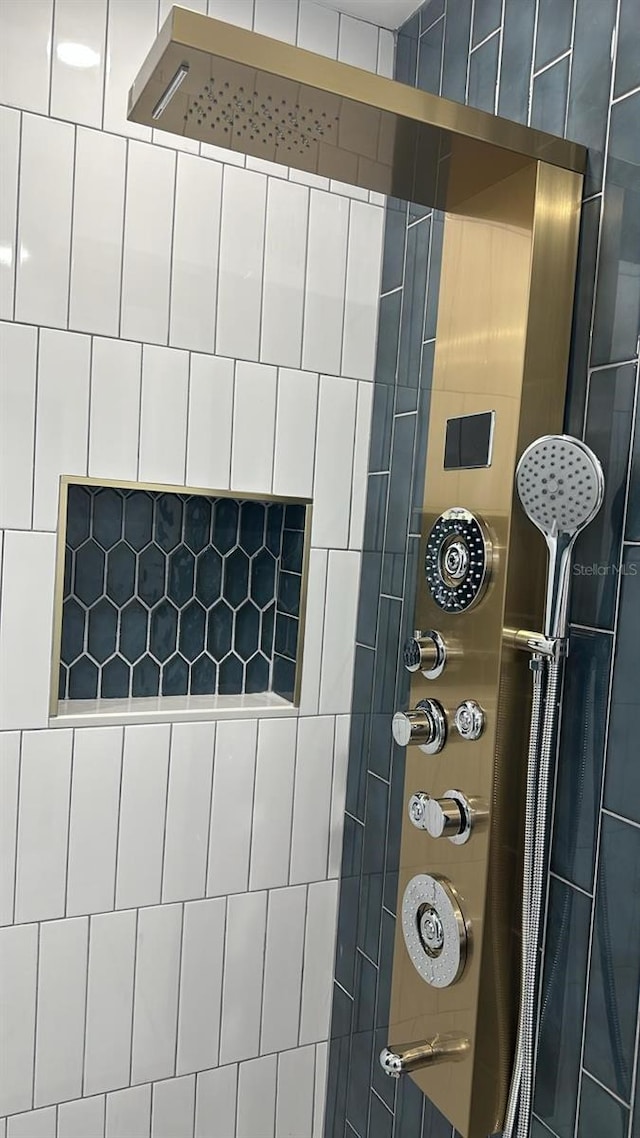 bathroom with a tile shower