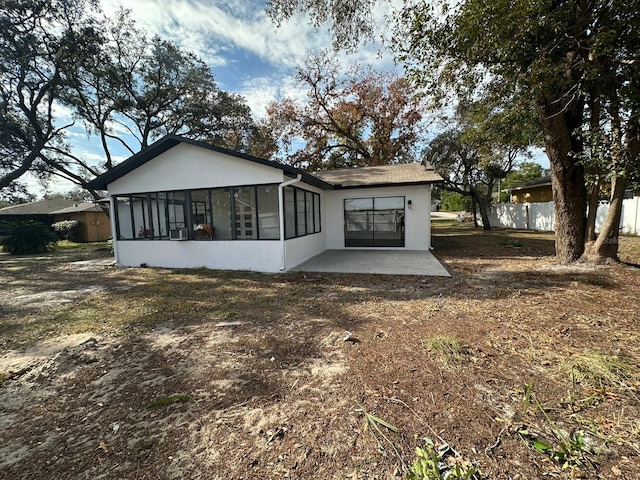 back of property featuring a patio area