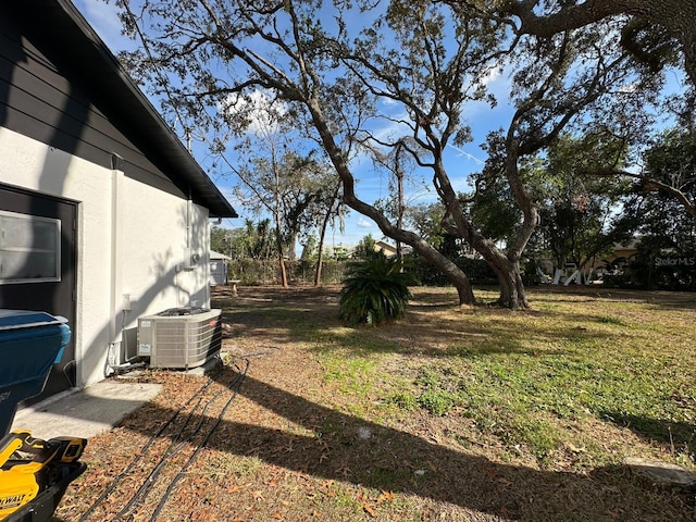 view of yard featuring central air condition unit