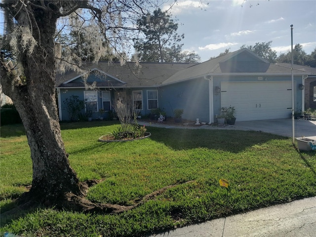 single story home featuring a garage and a front lawn