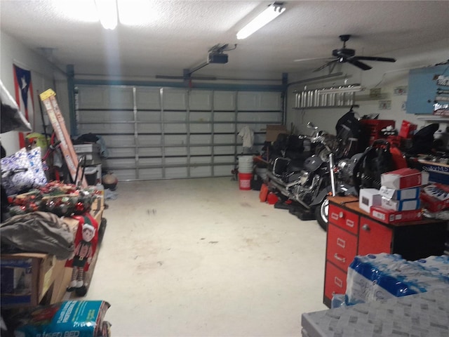 garage featuring ceiling fan and a garage door opener