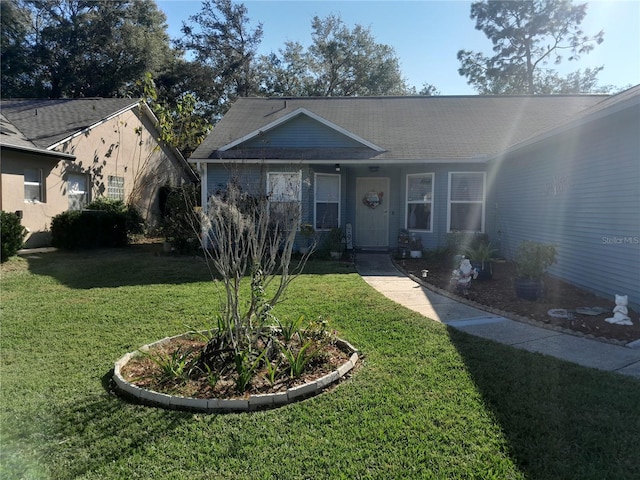 single story home featuring a front yard