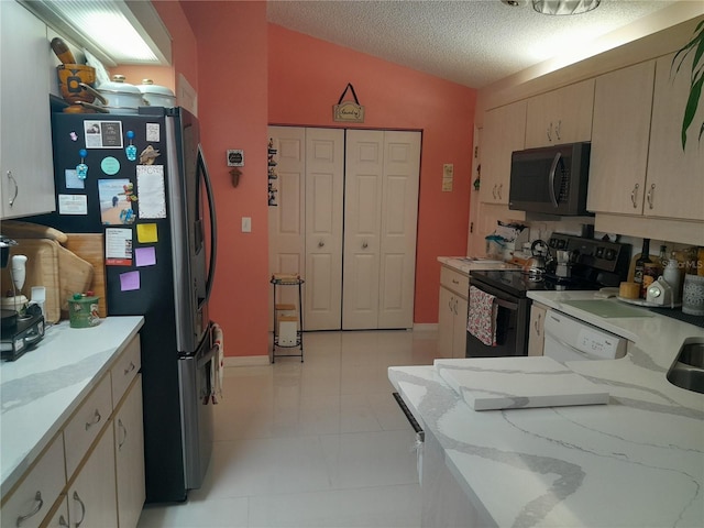 kitchen with lofted ceiling, dishwasher, a textured ceiling, black / electric stove, and stainless steel fridge