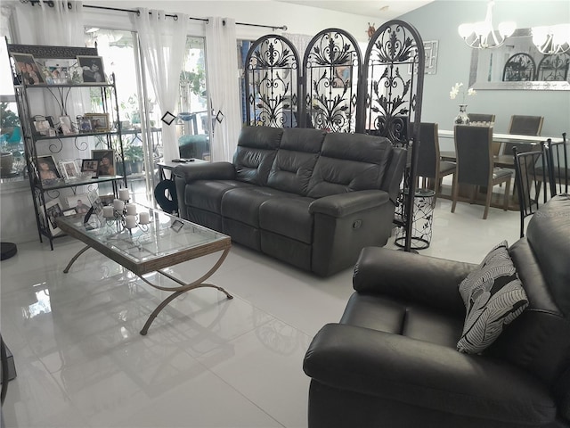 living room with an inviting chandelier and light tile patterned flooring