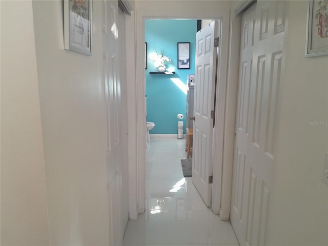 hallway with light tile patterned flooring