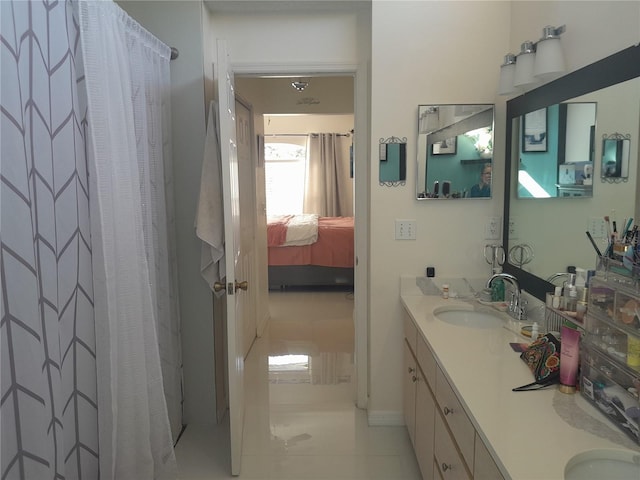 bathroom with vanity and a shower with shower curtain