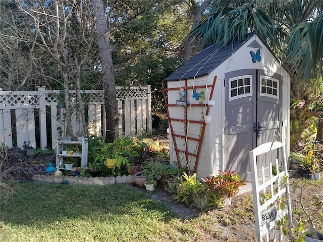 view of outbuilding featuring a lawn