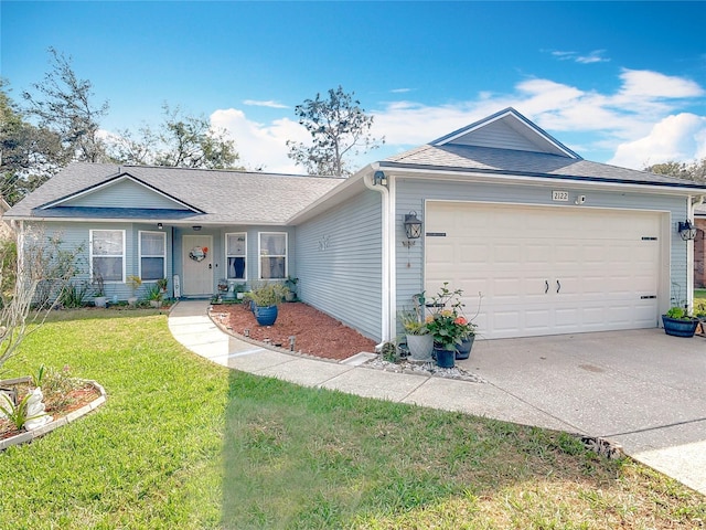 ranch-style home featuring a garage and a front yard