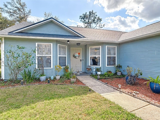 single story home featuring a front yard