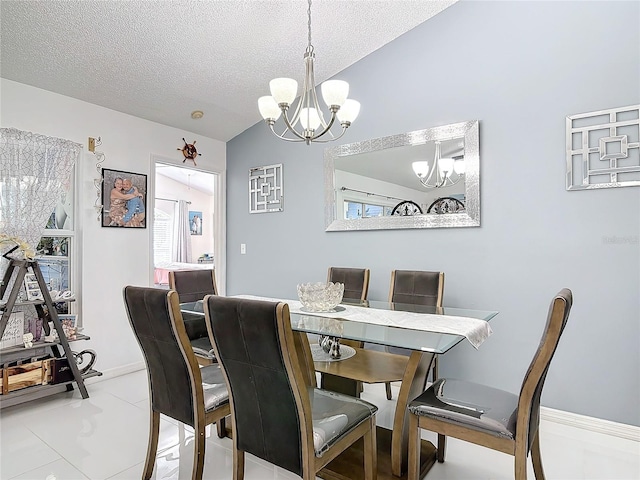 dining space with a wealth of natural light, vaulted ceiling, a textured ceiling, and a notable chandelier