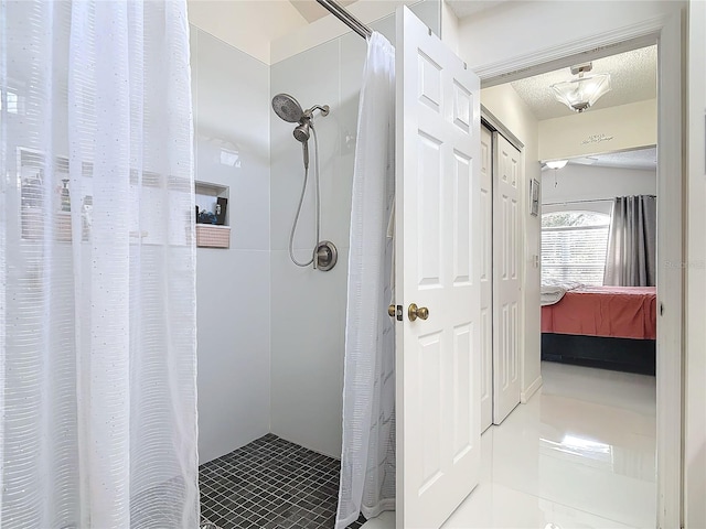 bathroom featuring tile patterned floors, a textured ceiling, and a shower with shower curtain