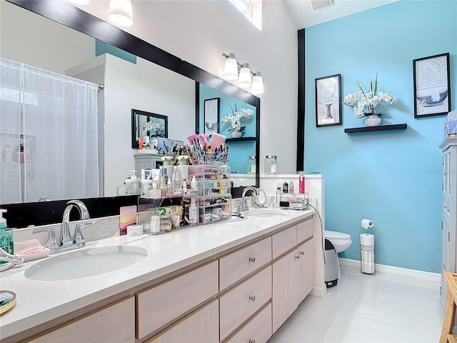 bathroom with tile patterned flooring, vanity, a shower with shower curtain, and toilet