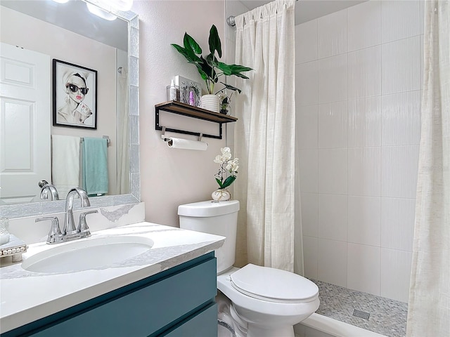 bathroom with walk in shower, vanity, and toilet