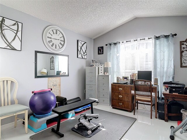 office area featuring vaulted ceiling and a textured ceiling