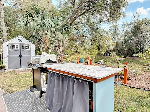 view of patio / terrace with grilling area and a shed