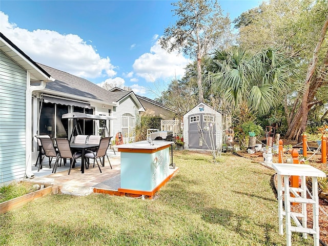 view of yard with a patio area and a shed