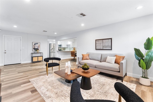 living room with light hardwood / wood-style floors