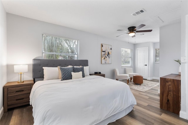 bedroom with ceiling fan and hardwood / wood-style floors