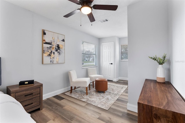 bedroom featuring ceiling fan and hardwood / wood-style flooring