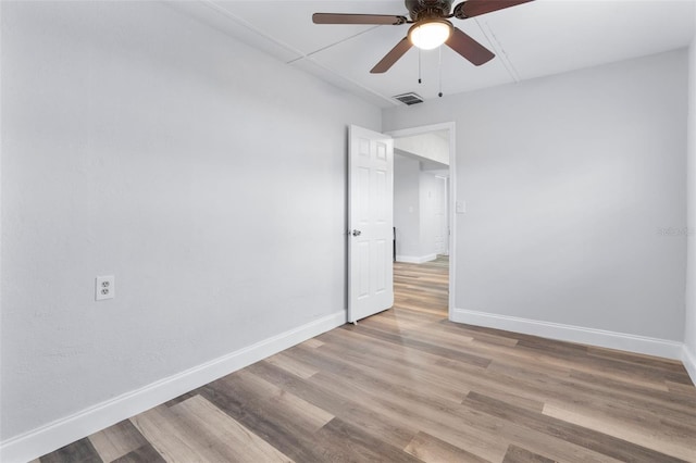 unfurnished room featuring ceiling fan and light wood-type flooring