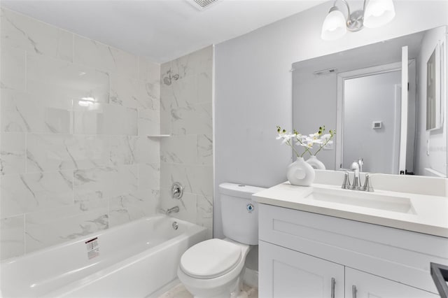 full bathroom featuring toilet, tiled shower / bath combo, and vanity