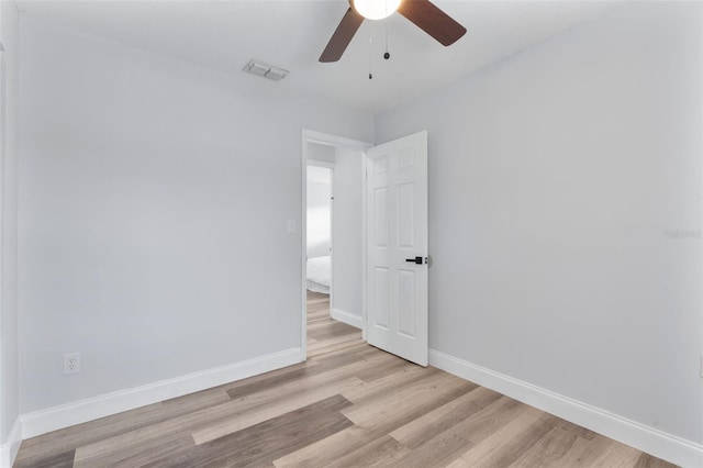 spare room with ceiling fan and light hardwood / wood-style floors