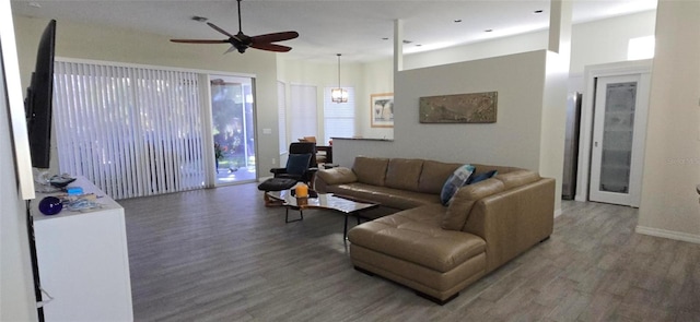 living room featuring hardwood / wood-style flooring, ceiling fan, and a healthy amount of sunlight