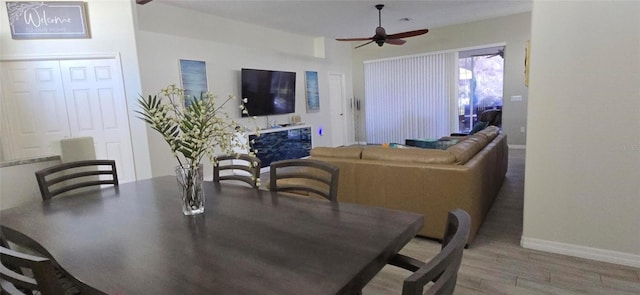 dining room featuring hardwood / wood-style floors and ceiling fan